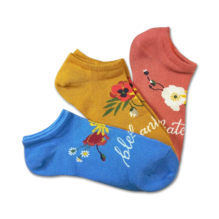 blessings 3 pack of no show socks for women feature inspirational floral patterns in various colors on a yellow, blue, or pink background.    }}