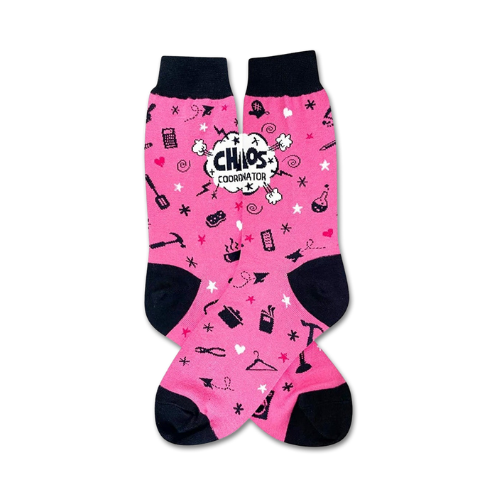 Pink crew socks with black cuffs. The socks have a fun design with various small icons, stars, and the words 'Chaos Coordinator' in a speech bubble. }}