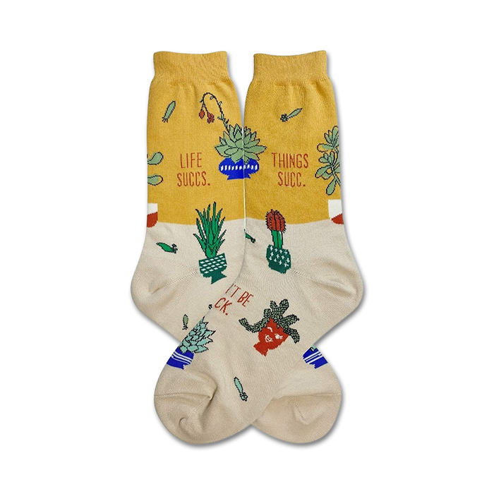 yellow and white crew socks with a pattern of succulent plants, and the words 'life succs ... things succ ... it is worth the pricks!!!'.   }}