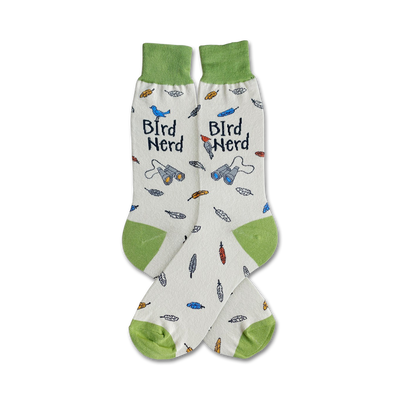 Cream crew socks with green cuffs. Design includes birds, feathers, binoculars, and 'Bird Nerd' text.