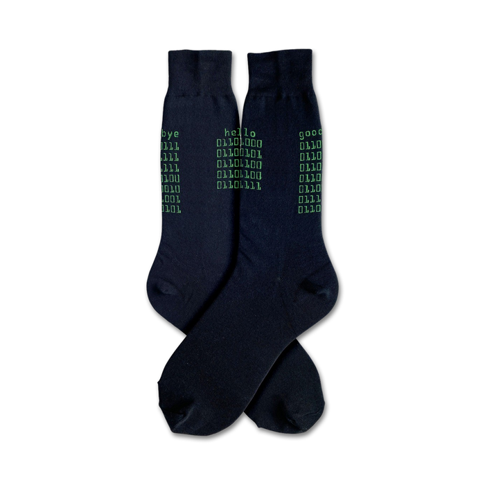 Pair of black crew socks with a green binary code design. The words 'hello', 'goodbye', and 'good' are also printed. }}