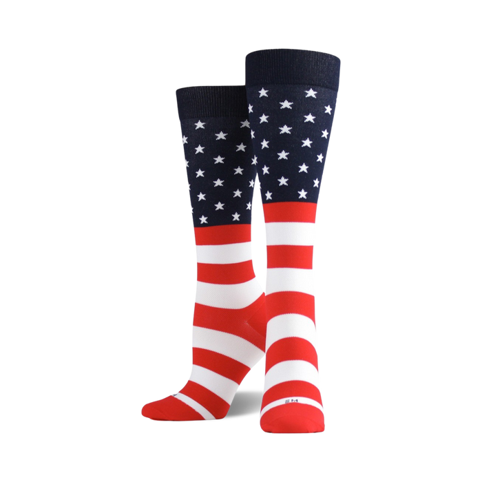 A pair of crew socks in red, white, and blue. The socks feature a design based on the American flag, with stars and stripes. }}