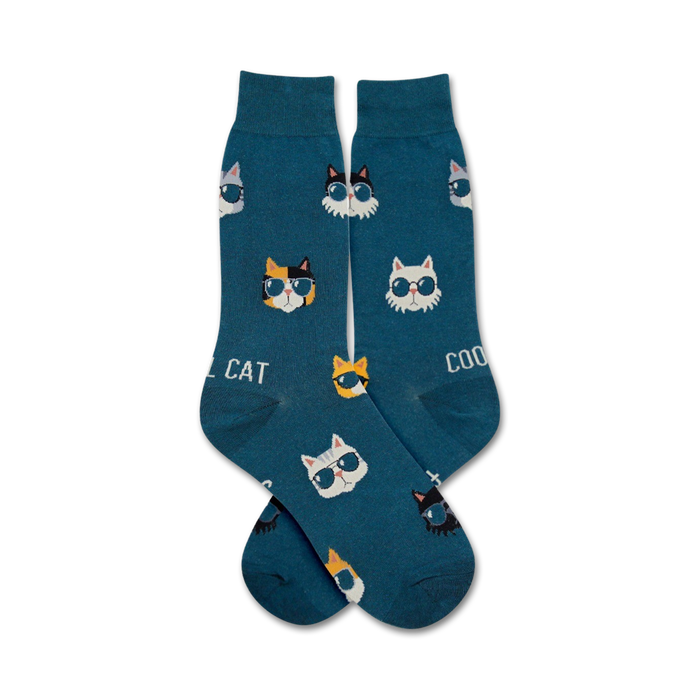 Pair of teal crew socks with a repeating pattern of cats wearing sunglasses. The cats are white, black, orange, and calico. }}