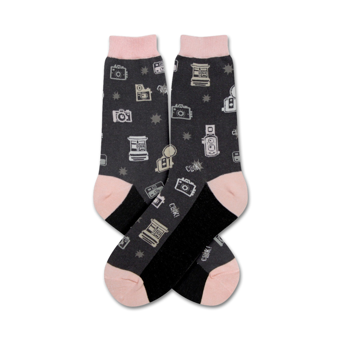 Pair of dark gray crew socks with a pattern of vintage cameras and stars. Pink and black accents. }}