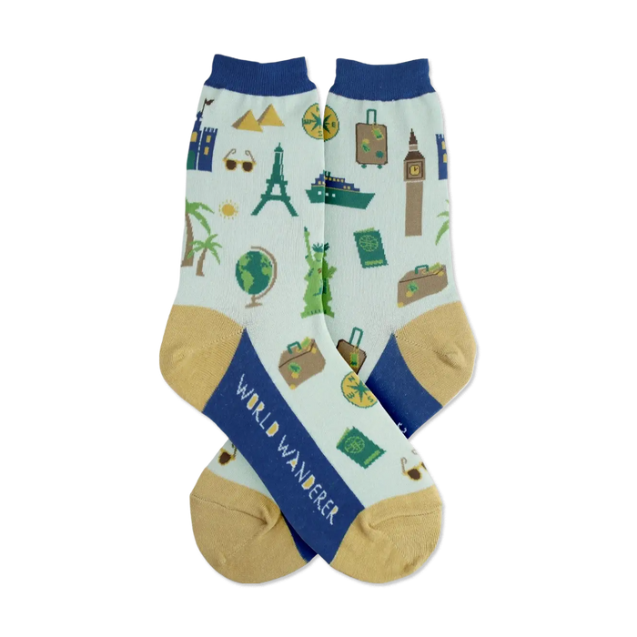 Pair of light teal crew socks with navy blue cuffs and gold heels. Features illustrated landmarks, suitcases, and travel icons. }}