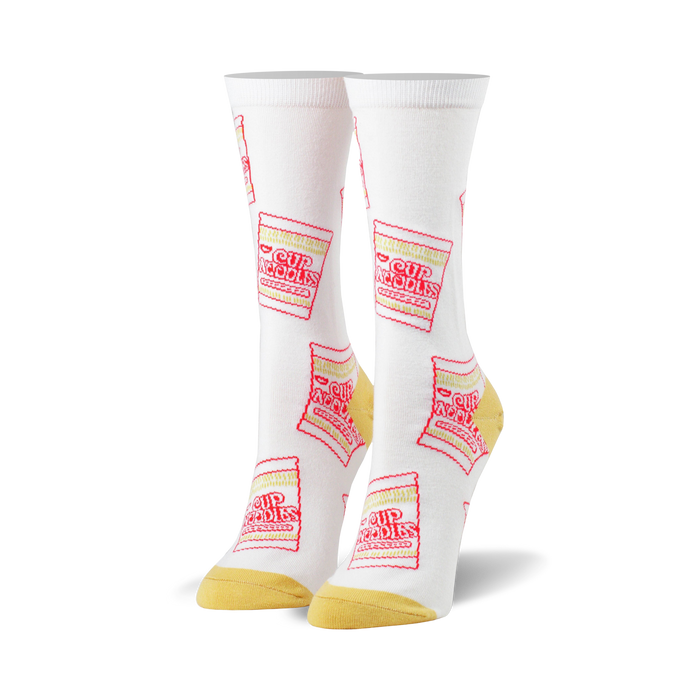 White crew socks with a repeating pattern of red and yellow Cup Noodles packaging. A fun and quirky design for everyday wear. }}