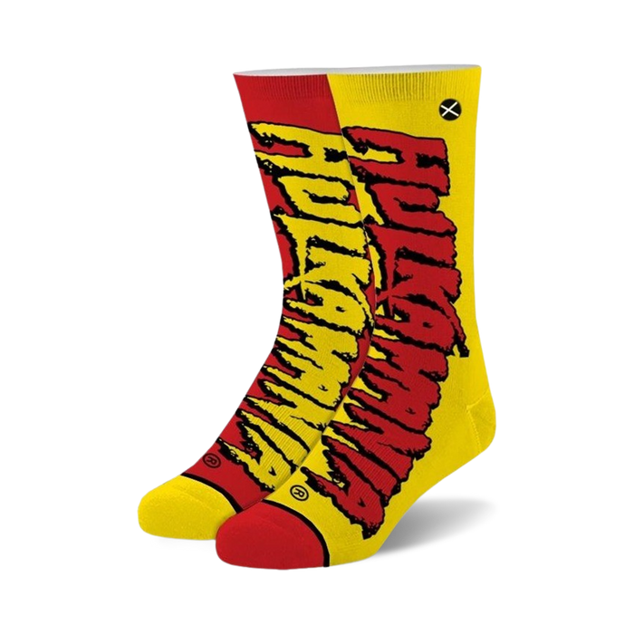 A pair of crew socks in red and yellow, featuring a stylized