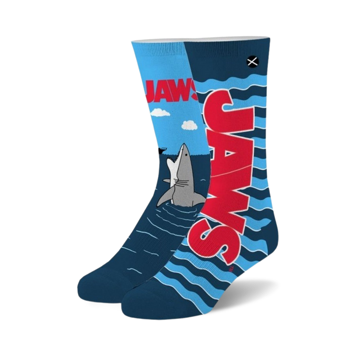 Crew socks in blue and red featuring the Jaws movie title and a cartoon shark emerging from the water. A fun, playful design for movie fans. }}