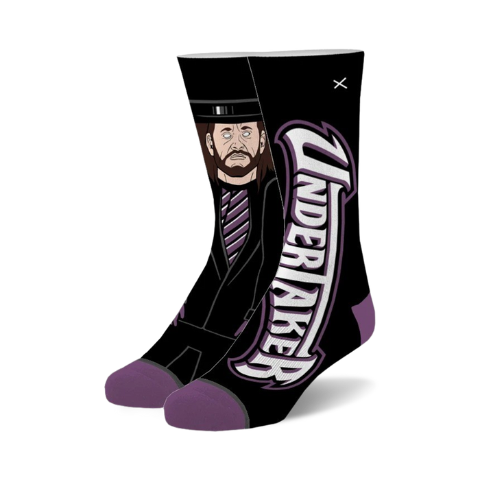 Pair of black crew socks with a purple and white Undertaker graphic.  Features a cartoon-style image of The Undertaker in his signature attire. }}