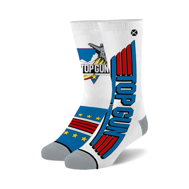 Pair of white crew socks with Top Gun logo and design elements in red, white, and blue. Features a jet plane image and the movie title.
