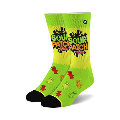 Pair of lime green crew socks with Sour Patch Kids logo and gummy candy illustrations. Black cuffs.