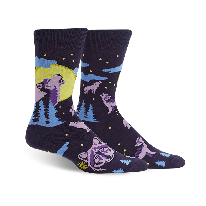 Crew socks in dark purple featuring howling wolves silhouetted against a yellow moon and light blue pine trees. Stars and other wolves decorate the background. }}