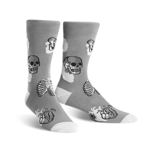 Gray crew socks with a fun anatomical print. Skulls, ribs, and hearts are featured in black line art against a light gray background.