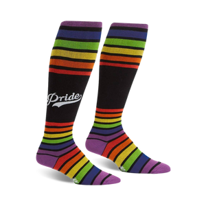Pair of rainbow striped knee-high socks with a retro 'Pride' logo on a black background.  Purple, orange, yellow, green, and blue stripes.