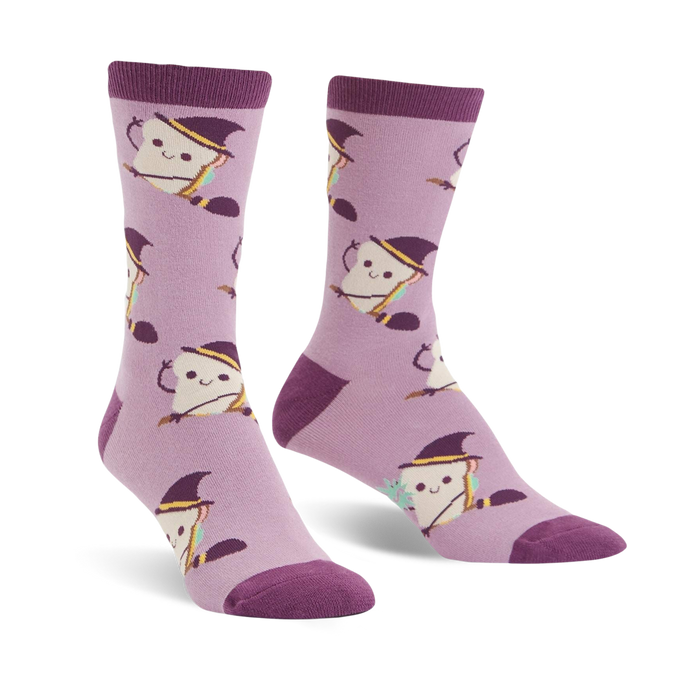 Lavender crew socks with a pattern of smiling toast wearing witch hats and holding broomsticks.  }}