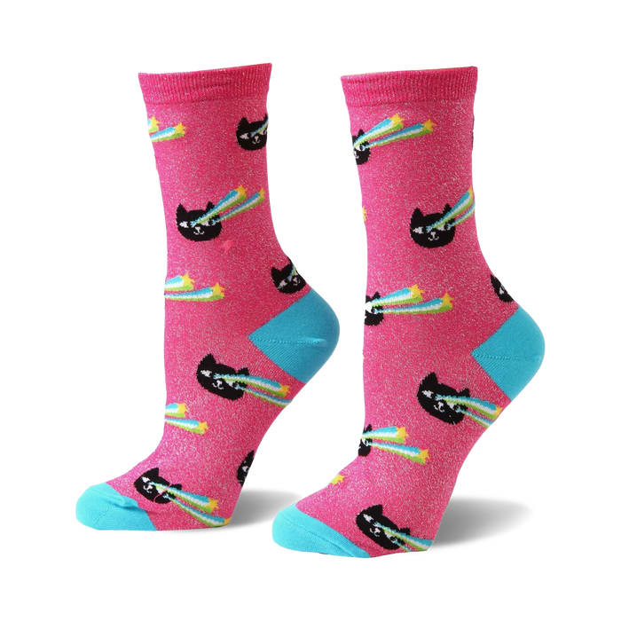Pair of women's crew socks. Pink background with black cats shooting rainbow lasers and yellow stars. Light blue cuffs. }}