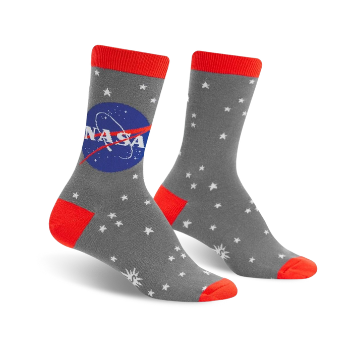 Gray crew socks with a vibrant red cuff, the NASA logo, and a white star pattern. Glow-in-the-dark design. }}