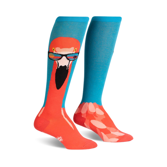 Pair of knee-high socks. One sock shows a flamingo wearing sunglasses; the other sock is teal with a flamingo pattern at the bottom. }}
