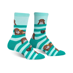 Crew socks in teal and mint green stripes featuring adorable otter designs. Otters are shown peeking from behind the stripes.