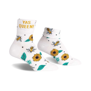 Pair of white ankle socks with a 'Yas Queen!' slogan, buzzing bees, and sunflowers.  Cute and comfy!