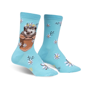 Pair of light blue crew socks featuring a cute hedgehog in a flower pot wearing a daisy crown, surrounded by smaller daisies.