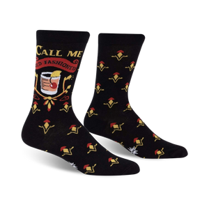 Black crew socks with an Old Fashioned cocktail graphic and 'Call Me Old Fashioned' text. Red, gold, and yellow details on a black background.