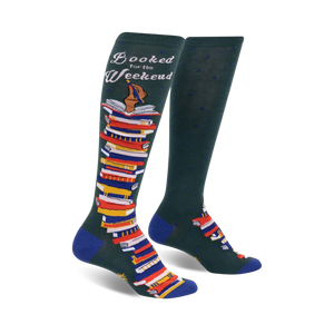 Pair of dark green knee-high socks with a colorful stack of books and the text 'Booked for the Weekend'. Blue accents at the cuffs.