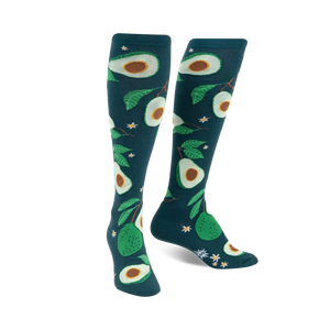 Pair of teal knee-high socks with a fun avocado and leaf pattern. The avocados are various shades of green.