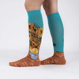 A pair of blue knee-high socks with a print of Van Gogh's painting 