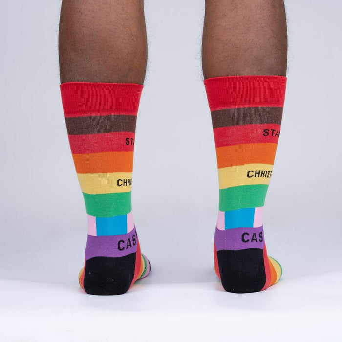 Rear view of a person's legs wearing the Streets of Pride socks, showcasing the back design.