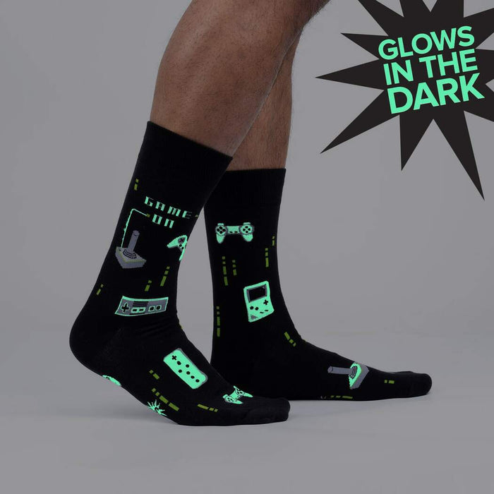 Close-up of the 'Game On' socks, highlighting the glowing details in the dark. The image emphasizes the glow-in-the-dark feature.