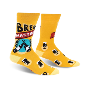 Crew socks in mustard yellow with a 'Brewmaster' design. Features beer bottles, mugs, and other beer-related graphics.