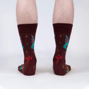 Rear view of a model's legs wearing the Beasts of Yore socks, highlighting the back design of the socks.