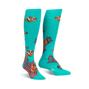 Pair of teal knee-high socks with a playful design of orange clownfish swimming among pink coral.
