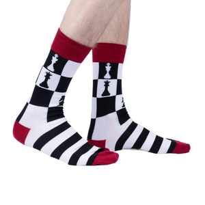 Lifestyle shot of a person wearing a pair of Lucky You socks. The socks are black, white, and red.