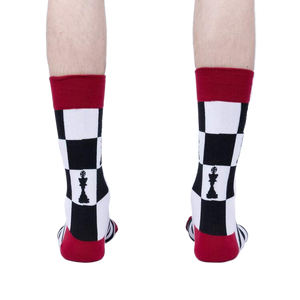 Close-up flatlay of Lucky You socks, showing the detail of the chessboard and stripes pattern.