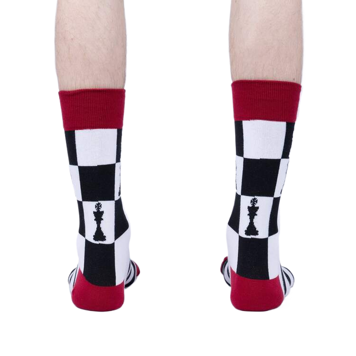 Close-up flatlay of Lucky You socks, showing the detail of the chessboard and stripes pattern.