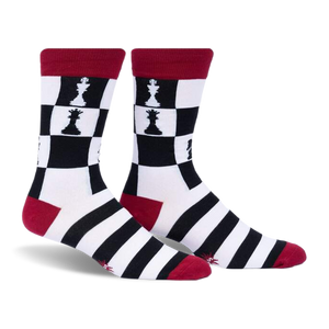 Pair of crew socks in black, white, and red.  Chessboard pattern with chess pieces features on the upper part of the socks and black and white stripes on the lower part.