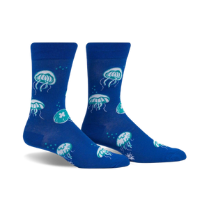 Pair of blue crew socks with a fun jellyfish pattern in teal and white.  The socks glow in the dark!
