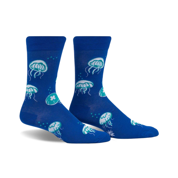 Pair of blue crew socks with a fun jellyfish pattern in teal and white.  The socks glow in the dark!