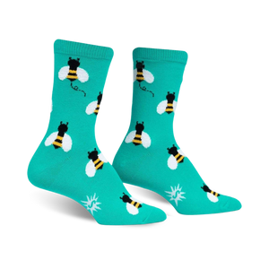 Pair of teal crew socks with a repeating pattern of black and yellow bees.