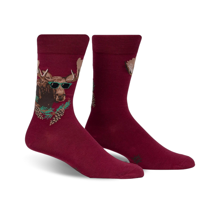 Burgundy crew socks with a graphic of a moose wearing sunglasses surrounded by pine branches. }}
