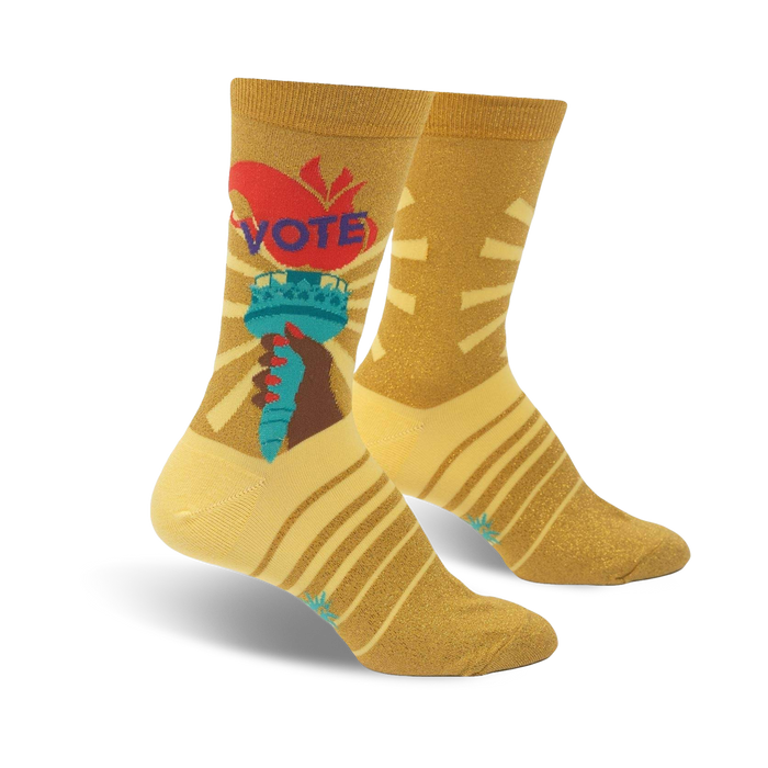 yellow and black striped crew socks with statue of liberty-like figure holding torch that says vote.  