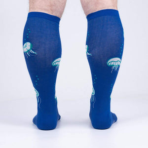 Rear view of 'Nice to Sea You' socks on a model, highlighting the full jellyfish print on the back.
