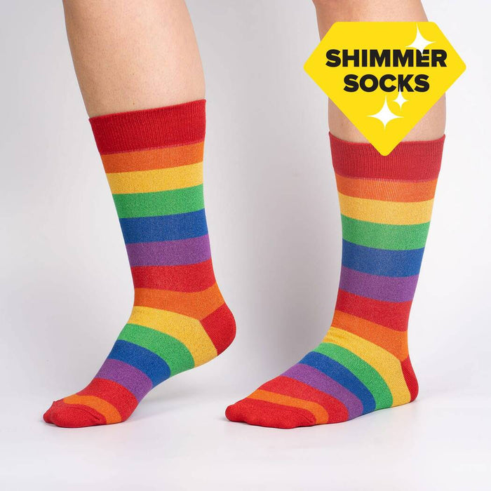 A pair of red and rainbow striped socks on a white background. The socks have a multicolored shimmer.