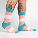 Lifestyle shot of Trans Pride socks on a person's legs, showcasing the fit and style.