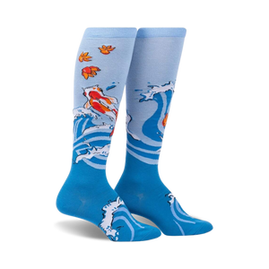 Pair of blue knee-high socks with a design of koi fish swimming in stylized waves and autumn leaves.