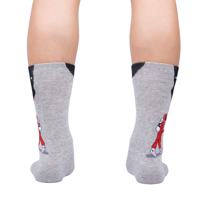 Rear view of the 'Moon Walk in the Morning' socks on a person's legs, showcasing the back design.