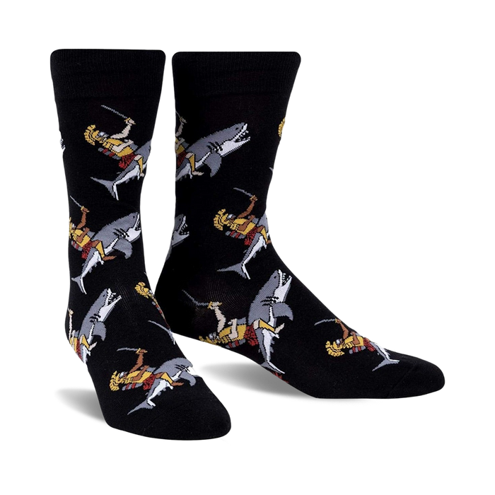 Pair of black crew socks featuring a repeating pattern of gladiators riding sharks.  The gladiators are depicted in gold, red, and white.