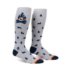 Knee-high socks in grey with a campfire and woodland creature design.  Dark blue and orange accents.
